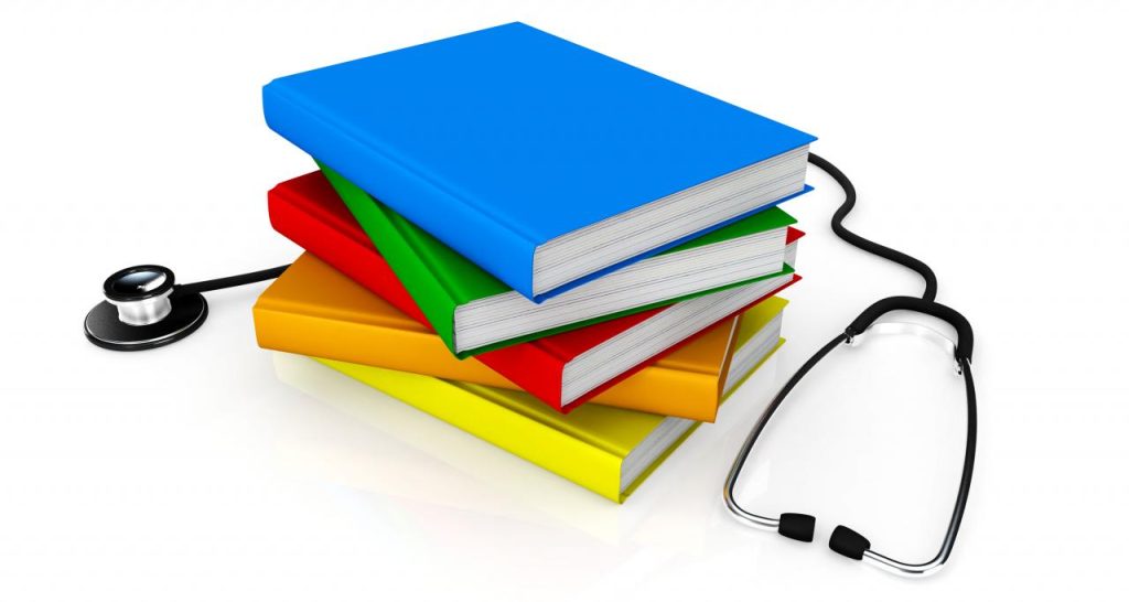 medical book and tetoscope